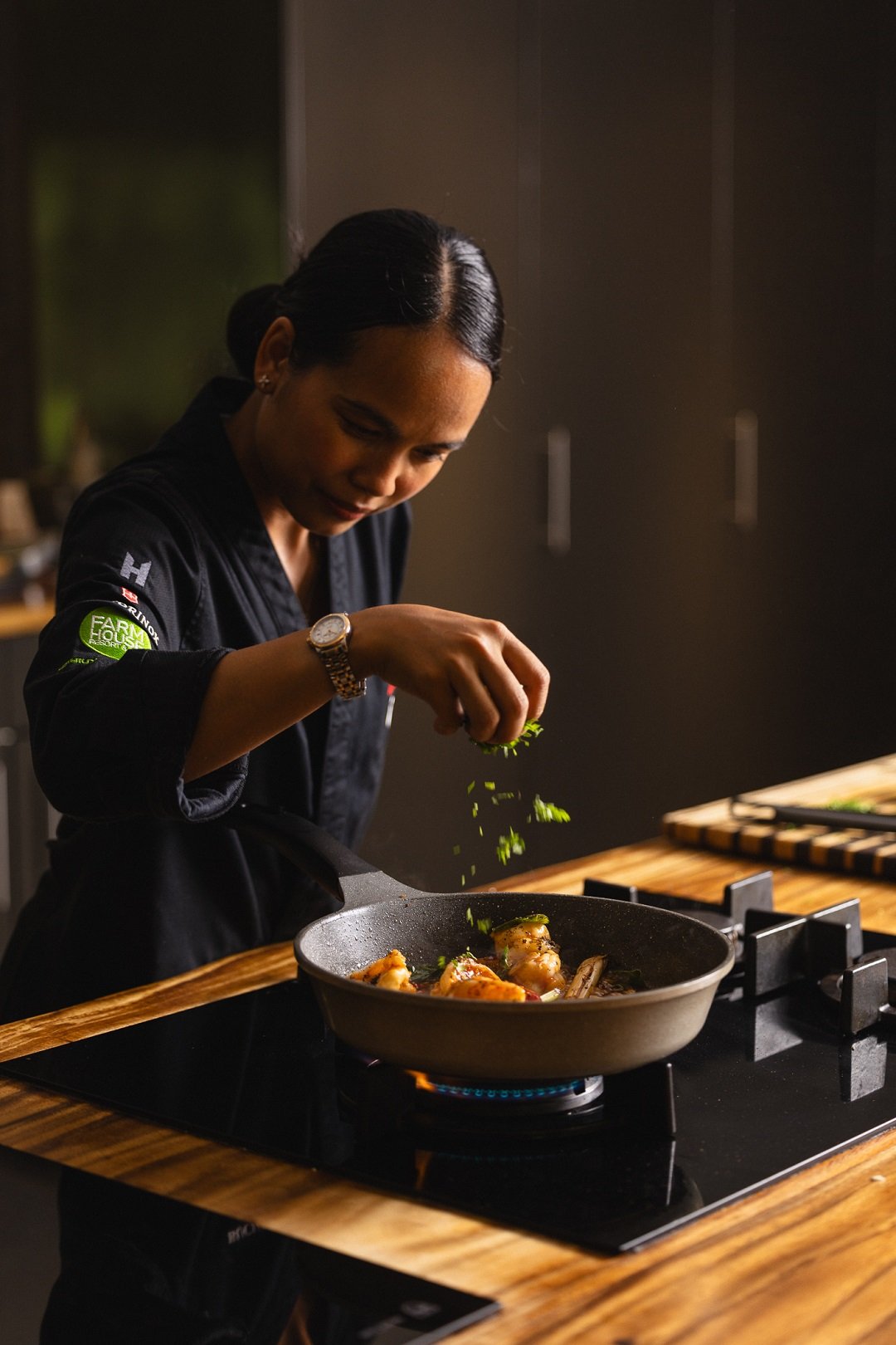Chef Mariya Un Noun preparing food for her namesake restaurant “UN” at the Farmhouse Resort and Spa
