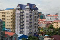 អគារ​អាផាតមិន​មួយ​កន្លែង នៅ​ក្នុង​ខណ្ឌ​ចម្ការ​មន រាជធានីភ្នំពេញ។
