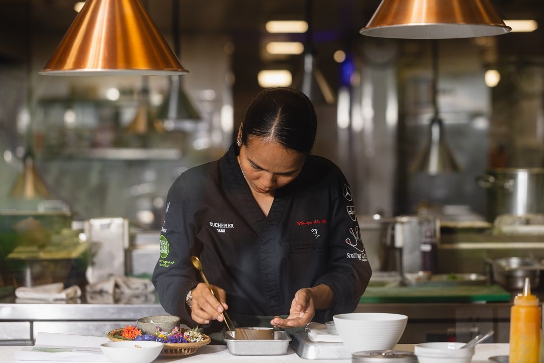 Chef Mariya Un Noun preparing food for her namesake restaurant “UN” at the Farmhouse Resort and Spa